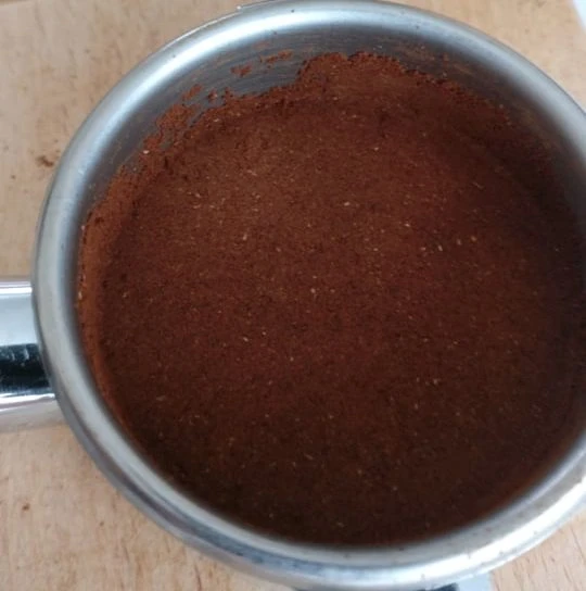 Budget tamper with coffee on the edges