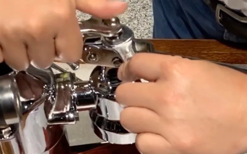 Unscrew the piston rod nut