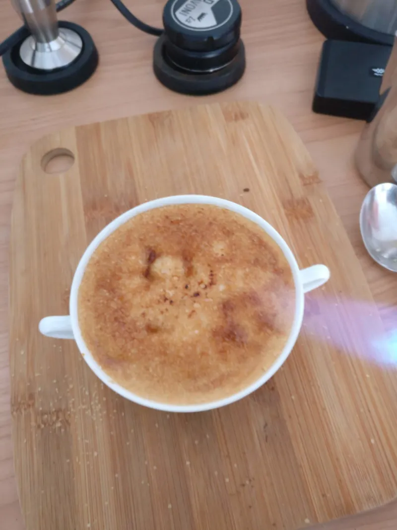 The brown sugar is caramelized using the blowtorch