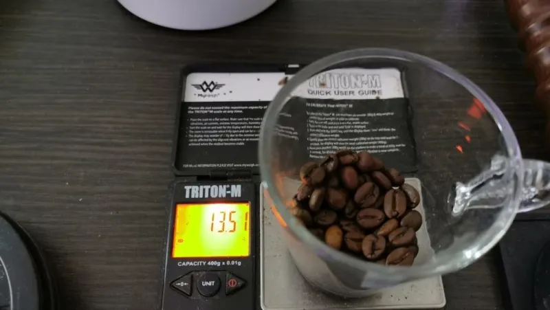 Weighing coffee before grinding
