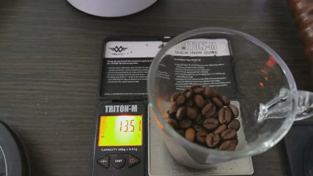 Weighing coffee before grinding