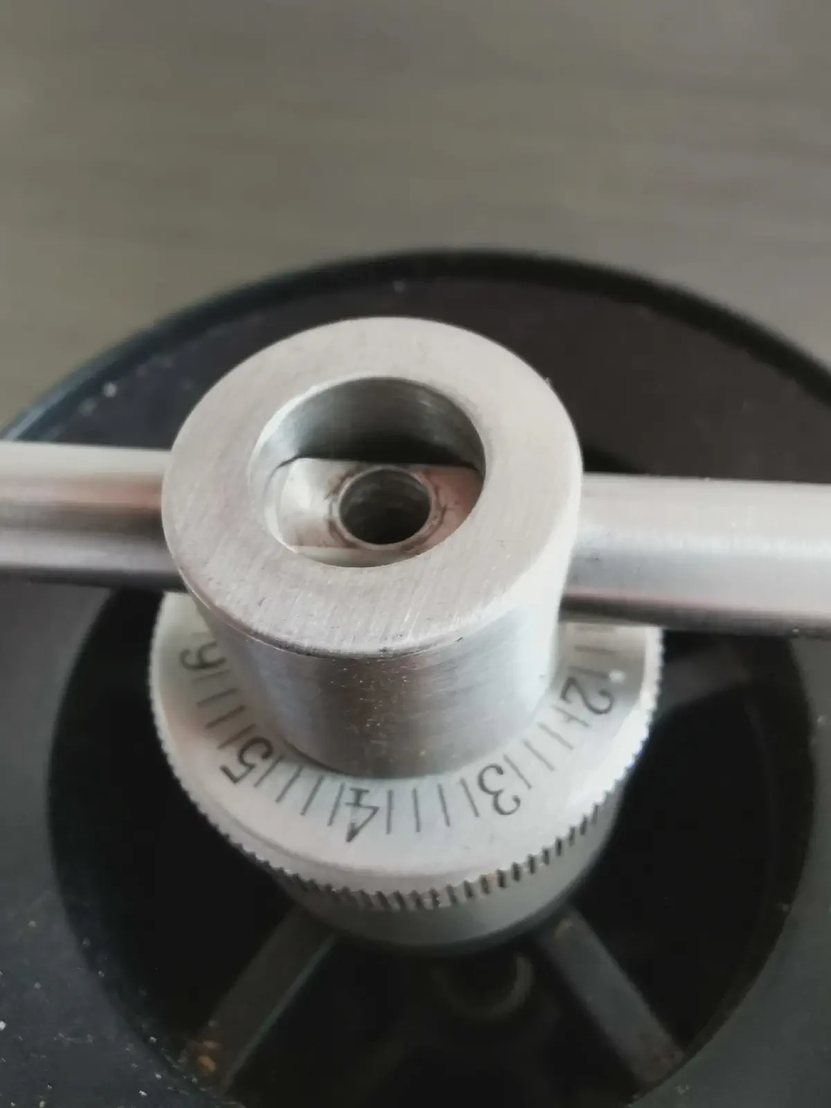 To remove the dial, you need to remove the screw on top