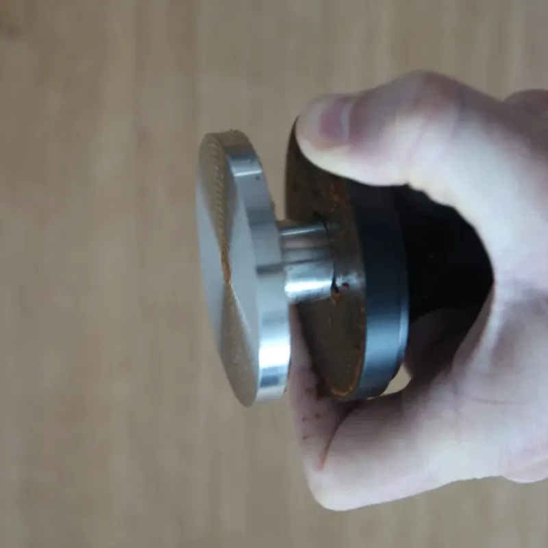 Tamper with coffee residue