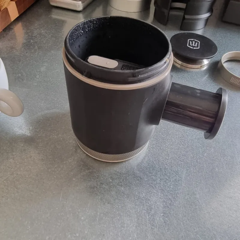 Puck screen placed on the coffee puck in the Picopresso