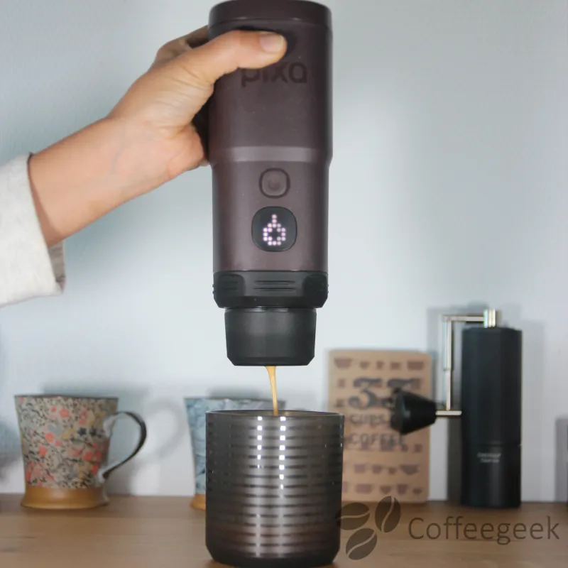 Extraction in progress: when the Nespresso capsule pierces, a pop sound is heard.