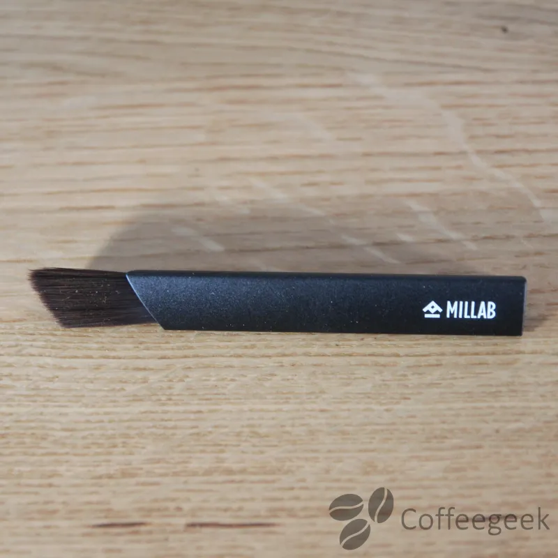 Black cleaning brush for coffee grinder maintenance