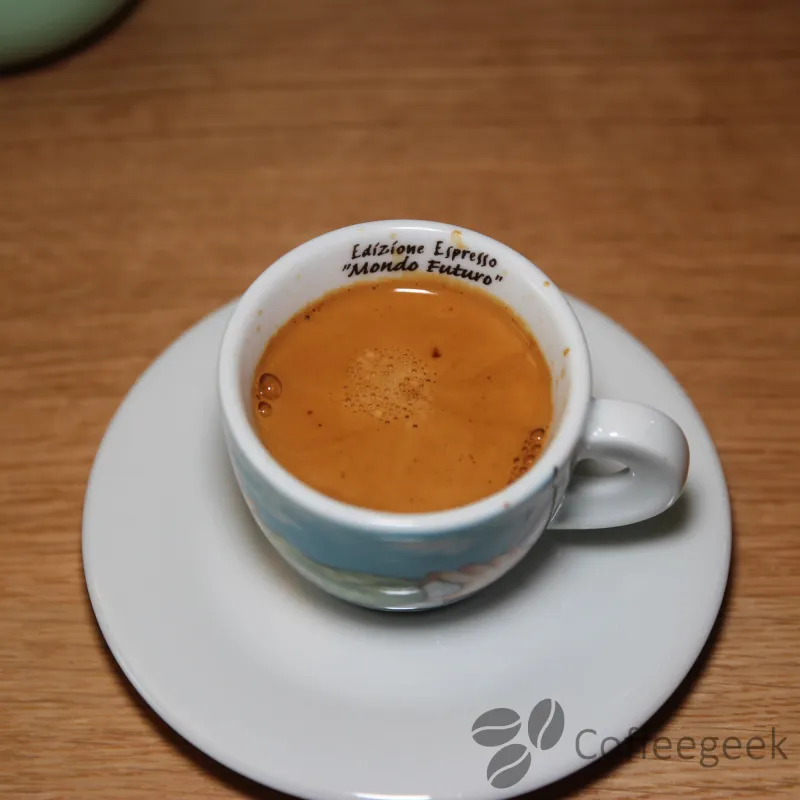 Cup of coffee with an overly dark extraction
