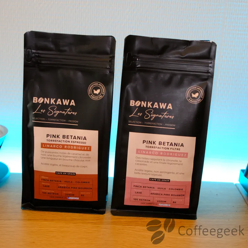Pink Betania filter roast bag on the left and espresso roast bag on the right